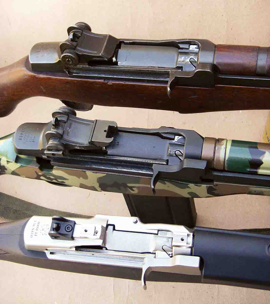 Although there are notable design differences between the M1 Garand (top), the M14/M1A (middle) and the Mini-14 (bottom), the basic design and function is similar.